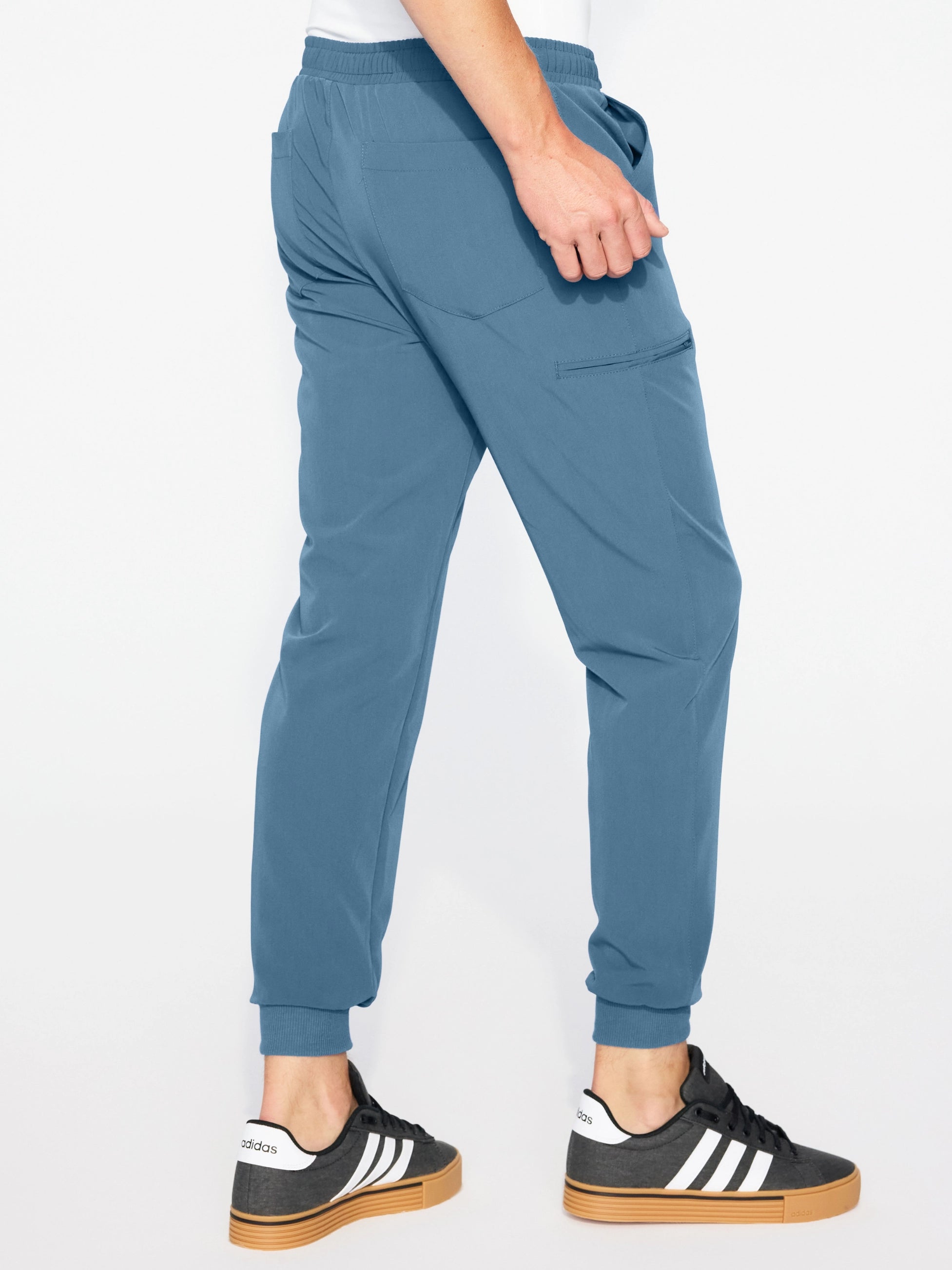 Spodnie medyczne męskie joggery GENUS candy blue widok z tyłu