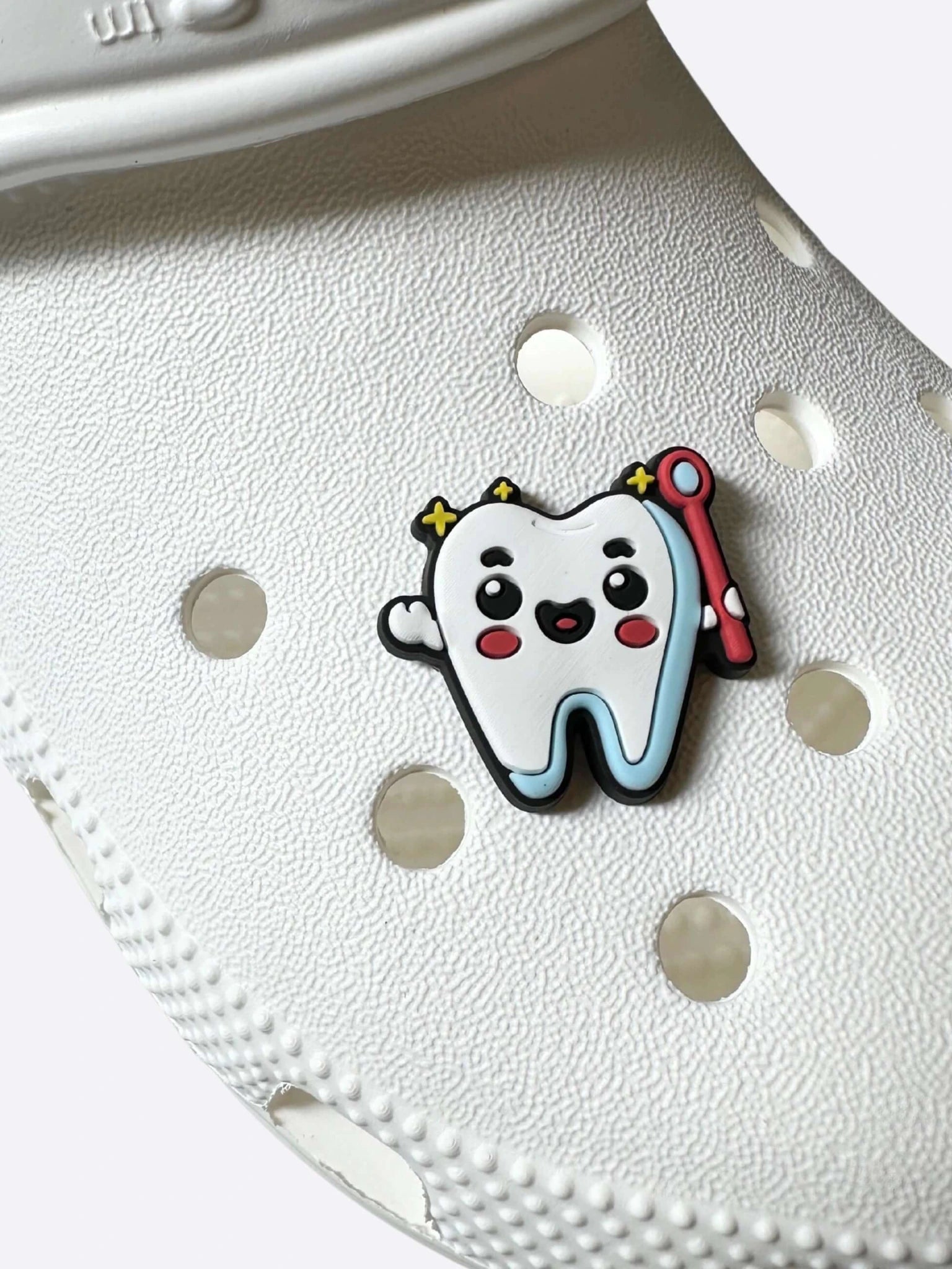 Tooth pin for Crocs on the shoe